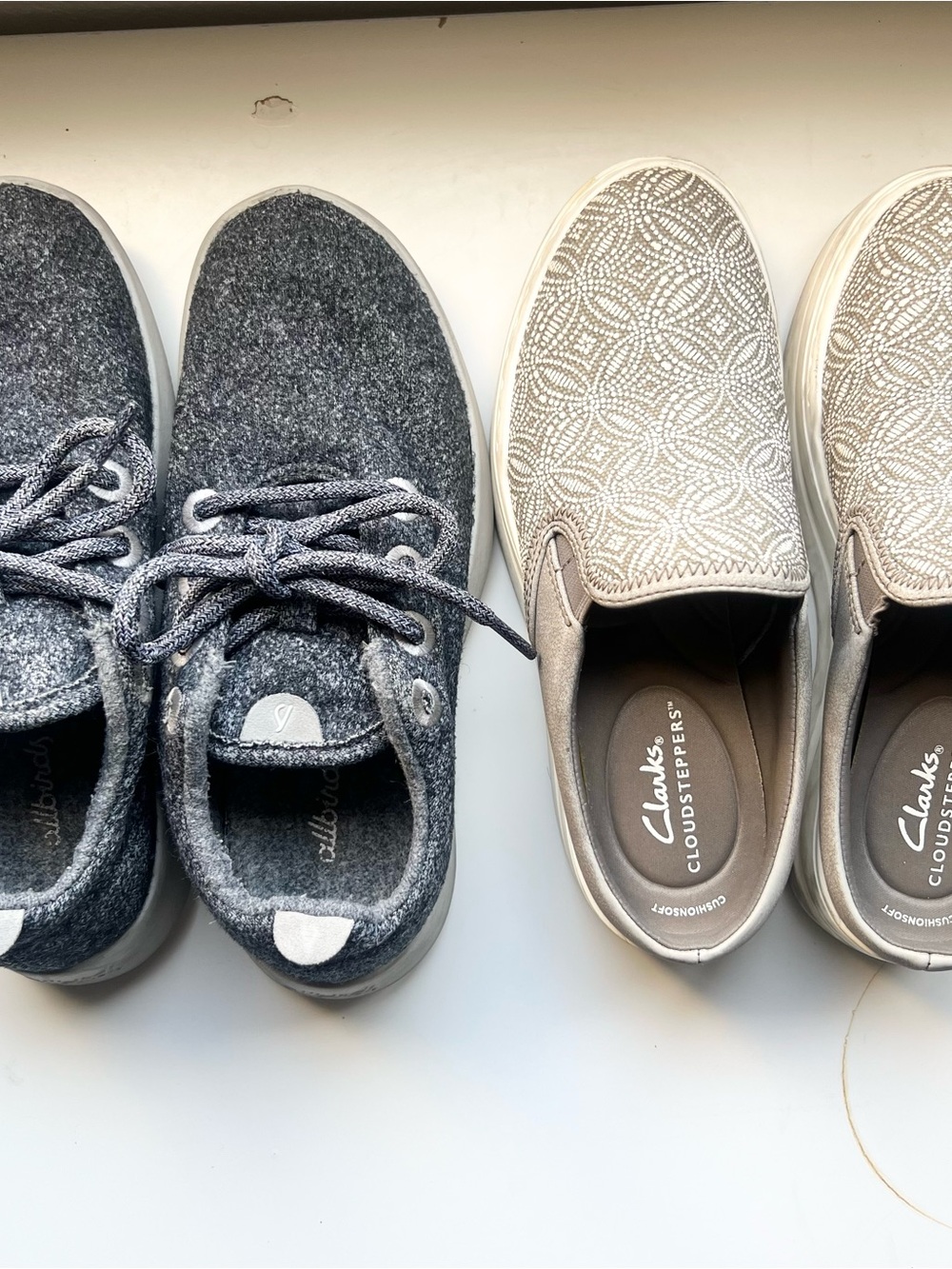 Two pairs of women's shoes: Clarks 5.5 and Allbirds 6